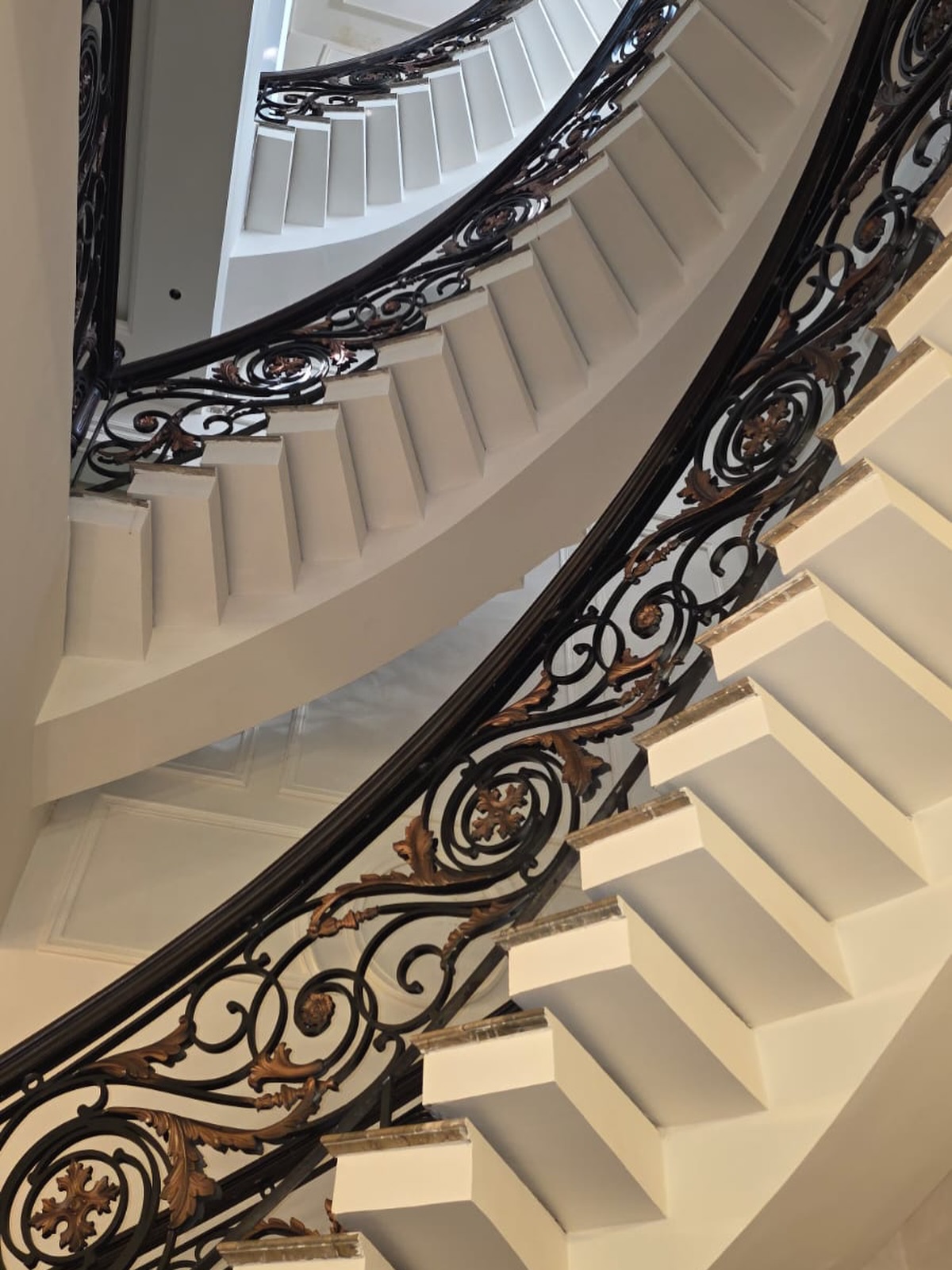 Stainless steel spiral staircase design for home in Delhi